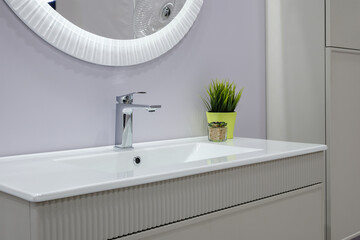 A bathroom sink with  faucet and a white countertop