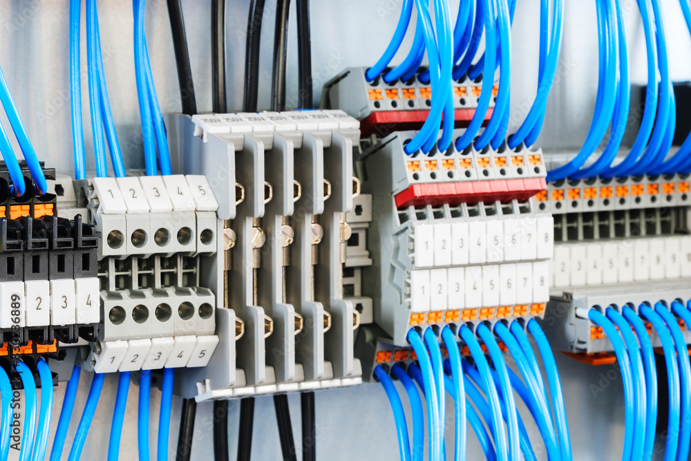 Poster a blue and white electrical cable with a number of different colored wires. the cables are connected