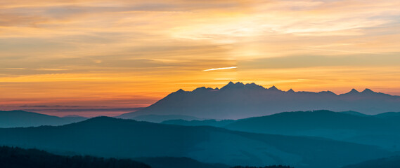 Sunset Over Rugged Mountain Peaks