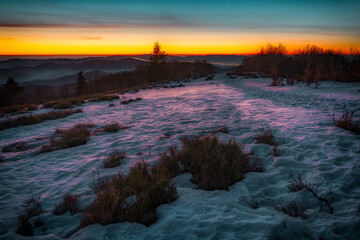 Winter Sunrise Over a Snow-Covered Landscape