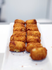 Crispy handmade ham croquettes fresh from the fryer