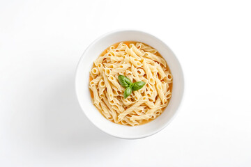 A bowl of pasta with basil garnish