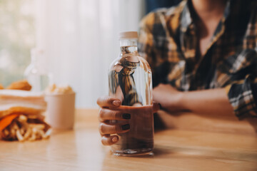 healthy beautiful young woman holding glass of water