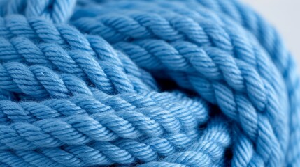  A close-up of a ball of yarn featuring a knot at its end The blue tip represents the end of the yarn