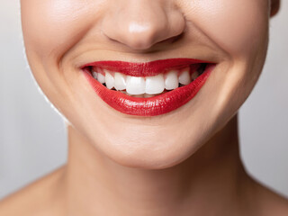 Fototapeta premium close up of a woman smiling, perfect teeth of a woman, dental care, advertising for whitening