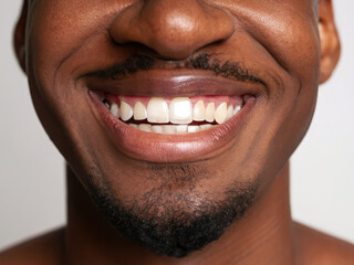 Fototapeta premium portrait of a mature man smiling, smile with perfect teeth, closeup on lips of a man, dental care, dentist advertising