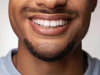 Fototapeta premium portrait of a mature man smiling, smile with perfect teeth, closeup on lips of a man, dental care, dentist advertising