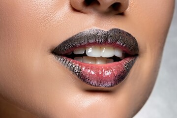 Naklejka premium close up lips of woman, black lipstick, beautiful smile, woman with perfect teeth