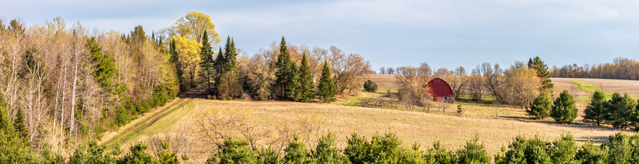 Wisconsin farmland with red barn in April