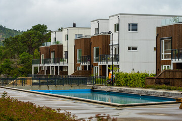 Apartment complex by a small pool.