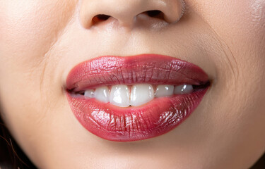Obraz premium close up lips of woman, red lipstick, beautiful smile, woman with perfect teeth