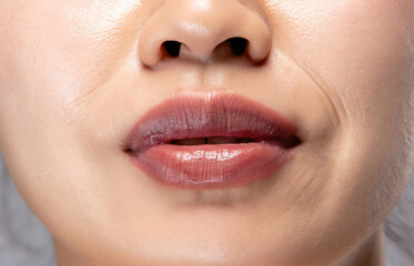 Fototapeta premium close up lips of woman, pink lipstick, beautiful smile, woman with perfect teeth