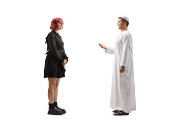 Man in ethnic muslim clothes talking to a woman in a black dress