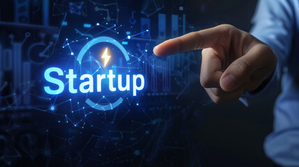 Entrepreneur's hand interacts with a futuristic 'startup' hologram, symbolizing innovative business initiation