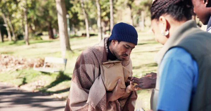 Man, begger and volunteer with food outdoor for feeding needy or homeless, support and humanitarian gesture for kindness. Team, handout and donation for charity or less fortunate, community and park.
