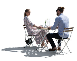 Backlit isolated image of two people sitting in a cafe on a romantic date on white background