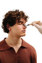 Surgeon drawing markup on nose before rhinoplasty surgery. Preparation for septoplasty and...