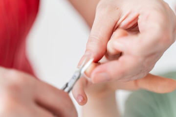 Mom cutting baby's nails. close-up. Selected Focus