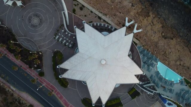 Malta National Aquarium aerial in the early morning during sunrise and golden hour. Star shape structure, modern architecture. Malta , Qawra, Aerial shot. High quality 4k footage