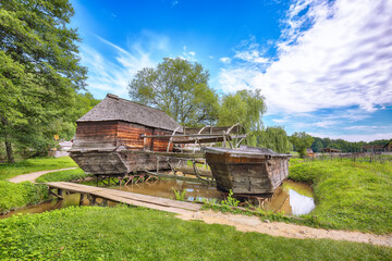 Amazing summer view of traditional romanian windmill.