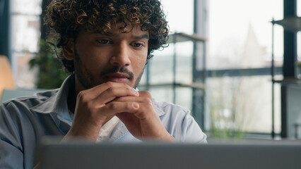 Pensive thoughtful Indian Arabian man male business person puzzled ethnic businessman employer...