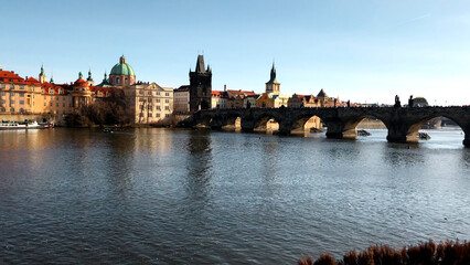 Fototapeta premium Prague city, river vltava and bridge. Media. Beautiful old architecture of the ancient city.