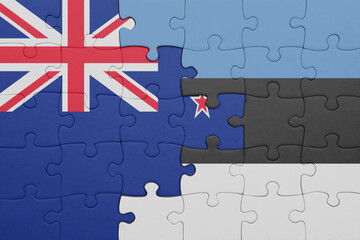 puzzle with the colourful national flag of estonia and flag of new zealand.