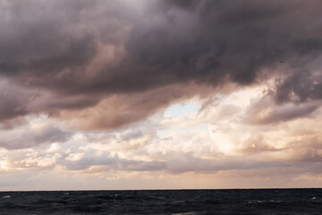 Beautiful landscape storm on sea and sunset with clouds