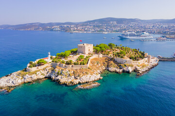 Pigeon Island with a Pirate castle in Kusadasi with cruise ship on background, Aegean coast of Turkey. Aerial view