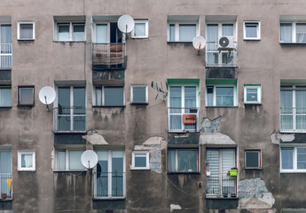 Poverty and misery of the Eastern Europe: old residential building of communist era. Facade wall...