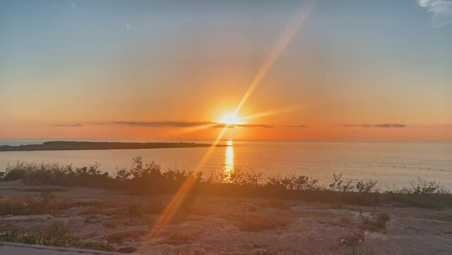 Beautiful golden sunrise in Qawra, Malta. Mediterranean sea. High quality 4k footage