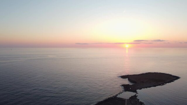 Malta Aerial, Qawra Pool in the early morning, during sunrise and golden hour. Static background shot. High quality 4k footage