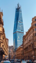 Modern glass tower standing out among the historic buildings in the old town city center