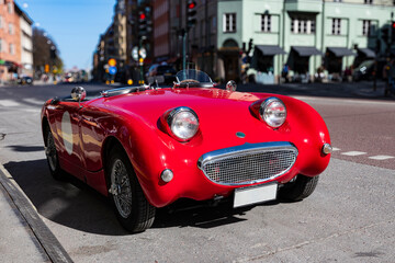 british classic red convertible car on the street