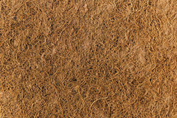 Mattress for a child made of coconut fiber. Background of coconut fiber
