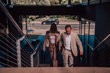 Modern business couple after a long day's work, walking together towards the comfort of their home, embodying the perfect blend of professional success and personal contentment.