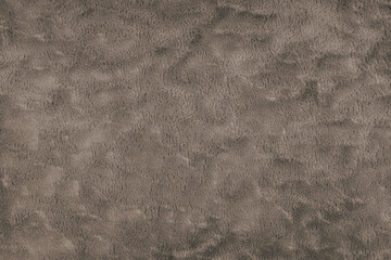 Texture of fluffy brown upholstery fabric or cloth. Fabric texture of artificial fur textile...