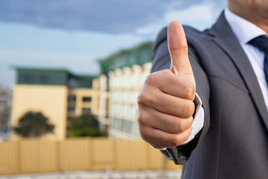 real estate agent giving thumb up, business man showing like, thumbs up