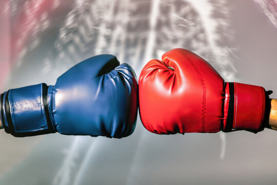 red boxing gloves, gloves of boxers, two challenging athletes - Powered by Adobe