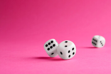 Many white game dices falling on pink background. Space for text