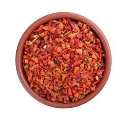 Aromatic spice. Red chili pepper flakes in bowl isolated on white, top view