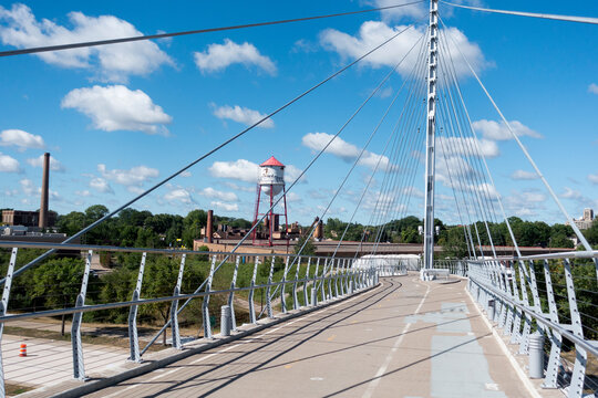Martin Olav Sabo Bridge spanning Hiawatha Avenue on the Midtown Greenway trail with a historic water tower at one end. Minneapolis Minnesota MN USA