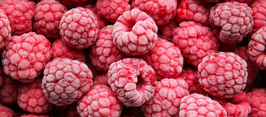 Tasty frozen raspberries as background
