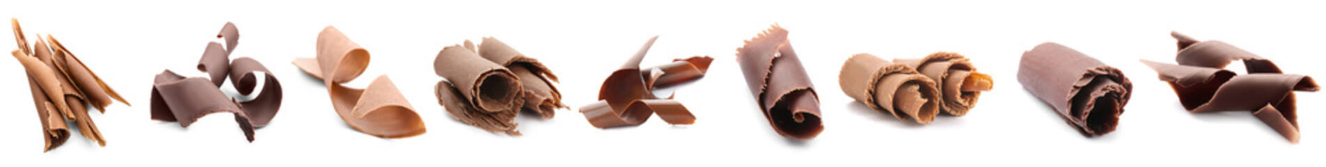 Set of sweet chocolate curls on white background