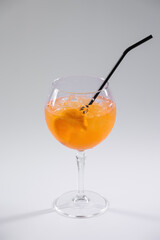 orange aperol spritz cold cocktail with ice in glass isolated on white background