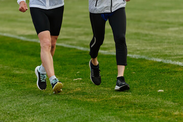 An inspiring and active elderly couple showcase their dedication to fitness as they running...