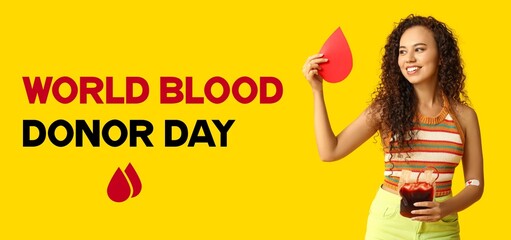 Female African-American donor with paper drop and blood pack for transfusion. World Blood Donor Day