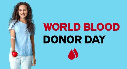 Female African-American blood donor with applied medical patch on her hand and heart. World Blood...