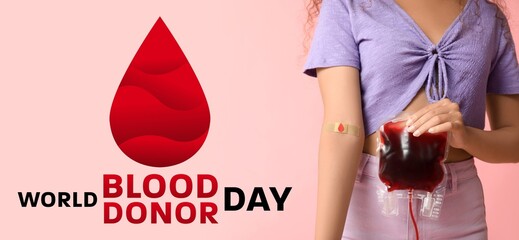 Female donor with blood pack. World Blood Donor Day