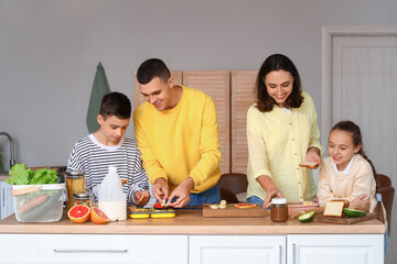 Happy family cooking in kitchen